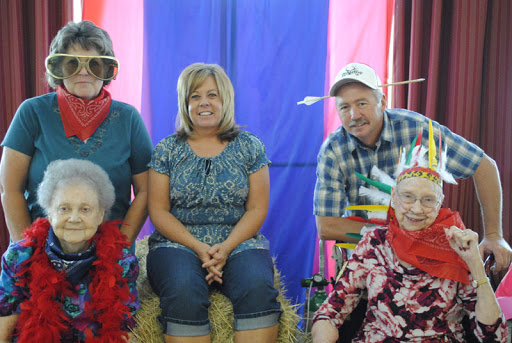 A joyful gathering of friends and family dressed in festive attire, capturing memories at a community event.