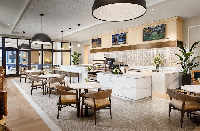 A modern cafe interior with elegant seating and lighting.
