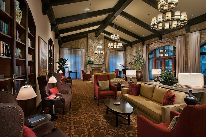 A luxurious and cozy lounge with elegant furniture and ambient lighting.