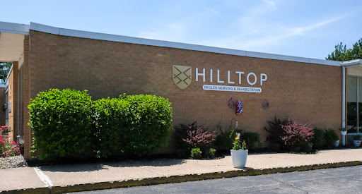 Exterior view of the Hilltop building with well-maintained landscaping.