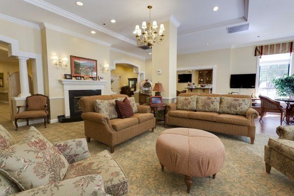 A cozy living room with elegant furniture and a warm atmosphere.