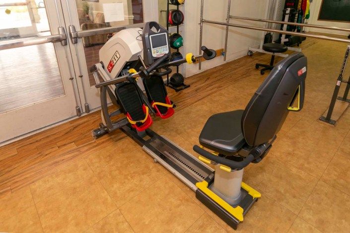 A rowing machine in a gym setting, ready for a workout session.