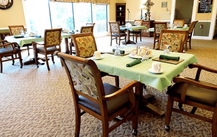 A cozy dining area with tables set for guests.