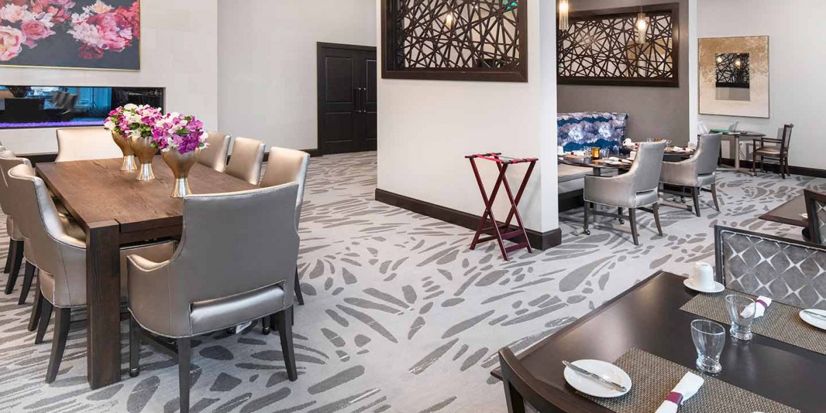A modern dining area with stylish furniture and contemporary decor.