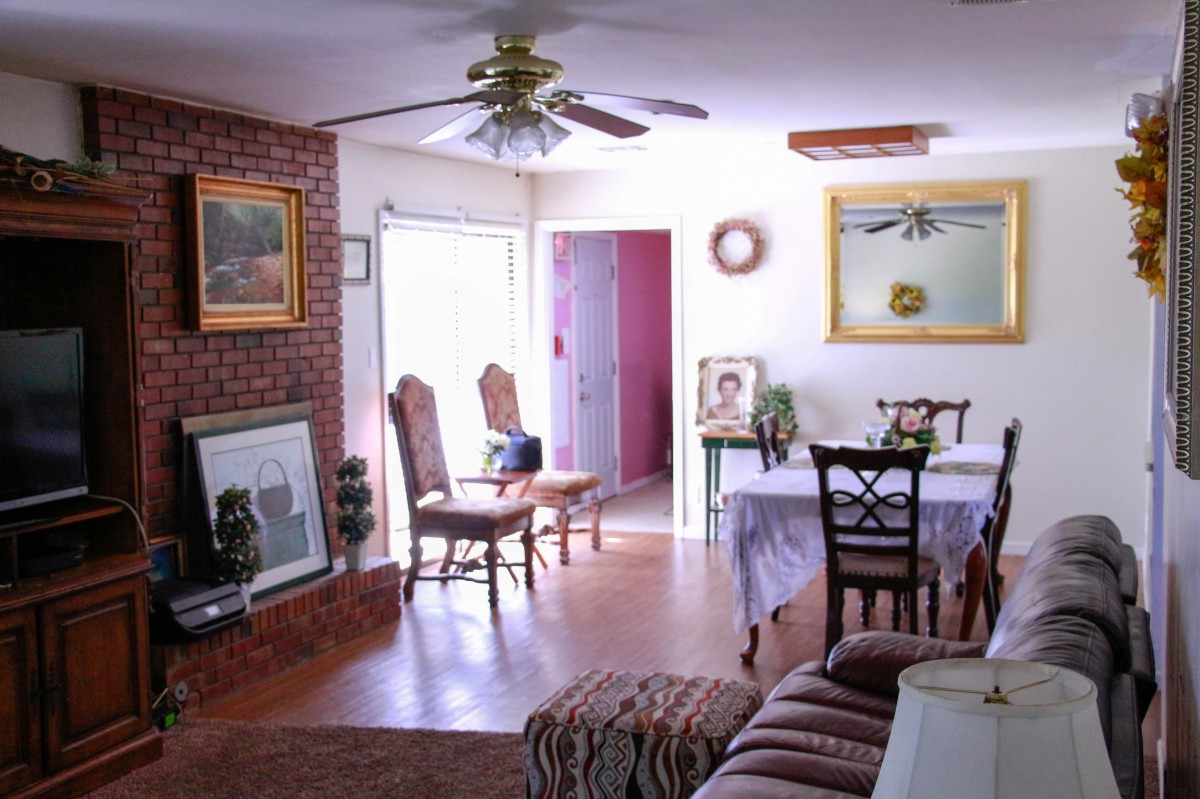 A cozy living and dining area with elegant furnishings and abundant natural light.
