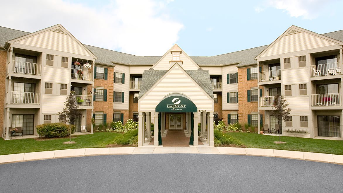 Front entrance of a hotel with a welcoming awning.