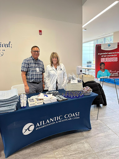 Healthcare professionals representing Atlantic Coast at a community event.