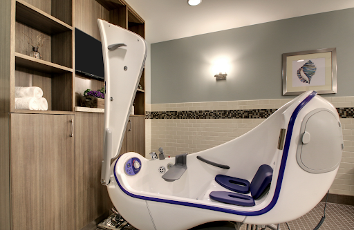 A modern relaxation pod designed for therapeutic experiences in a serene spa environment.