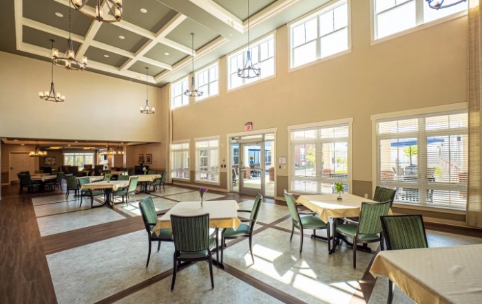 Spacious dining area with ample natural light and modern decor.