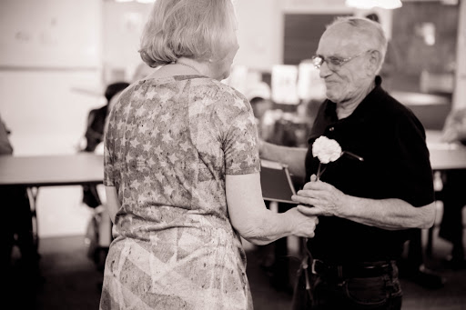 A heartfelt moment shared between two individuals during a ceremony, capturing the essence of connection and celebration.
