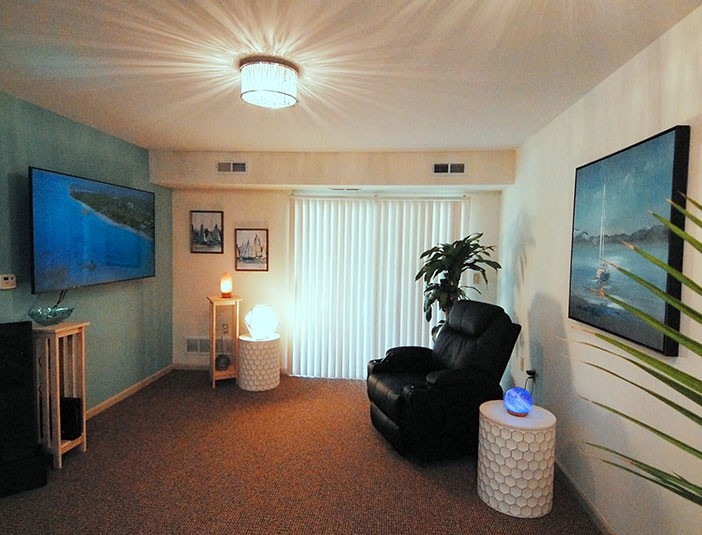 A cozy living room with modern furnishings and soft lighting.
