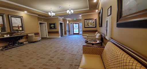 A spacious and inviting lobby featuring comfortable seating and elegant lighting.