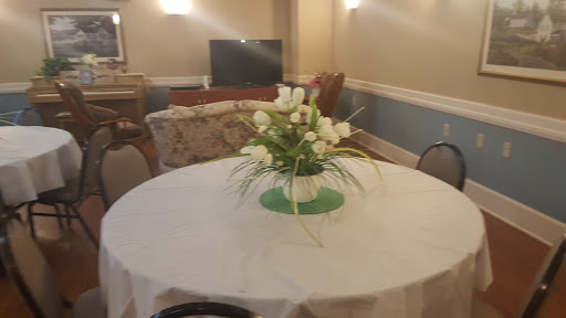 A beautifully arranged floral centerpiece on a dining table in a cozy living area.