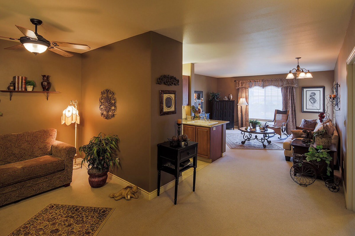 Cozy living room interior with warm lighting and elegant decor.