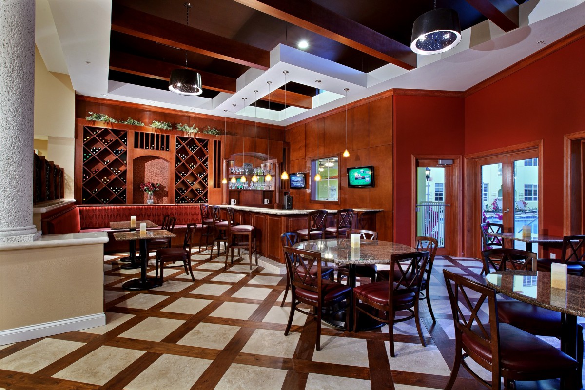 Cozy restaurant interior with elegant table settings and warm decor.