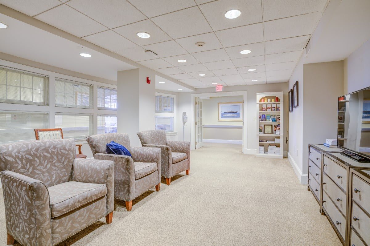 A well-lit waiting room with comfortable chairs and modern decor.