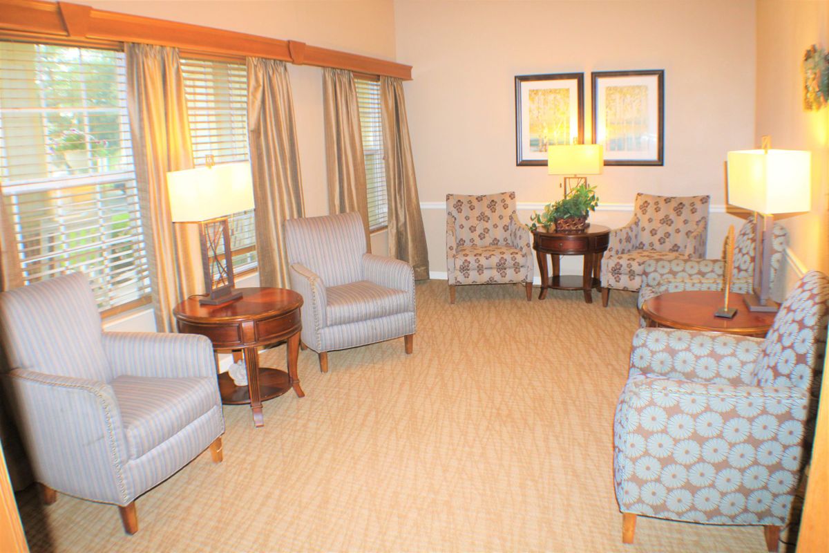 A cozy living room with comfortable seating and warm lighting.