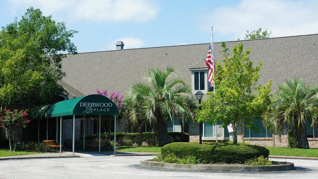 Entrance of a building with an awning and American flag.