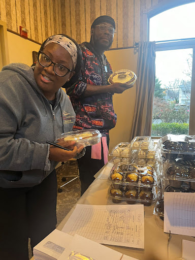 Participants enjoying a delightful selection of cupcakes at a community event.