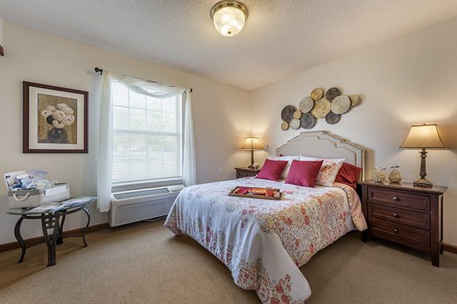 Cozy bedroom with decorative elements and a well-lit atmosphere.