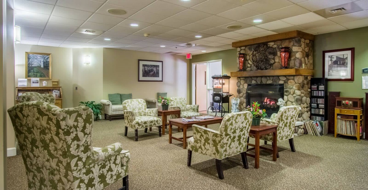 A cozy lobby area with comfortable seating and a fireplace.