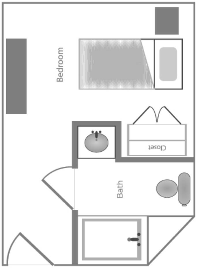 A simple floor plan showing a layout with a bedroom and an adjacent bathroom.