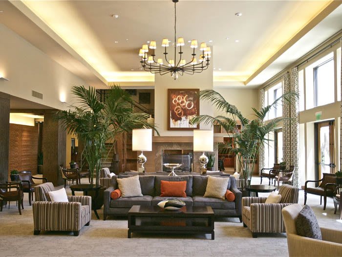 Modern living room with elegant decor and a cozy fireplace.