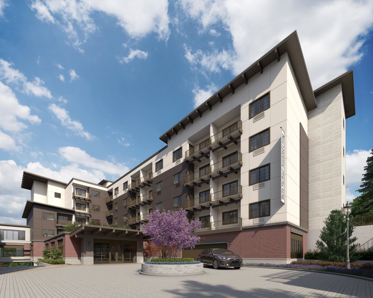 A modern hotel building with a stylish architectural design under a partly cloudy sky.