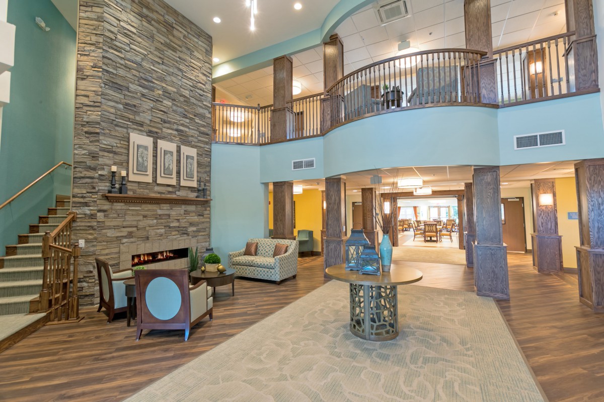 A spacious and modern lobby with stylish furniture and decorative elements.