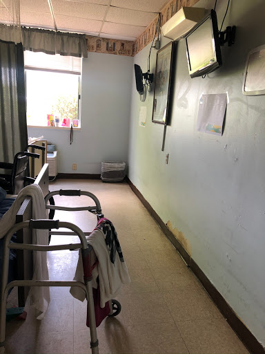A view of a hospital room featuring patient equipment and a window.