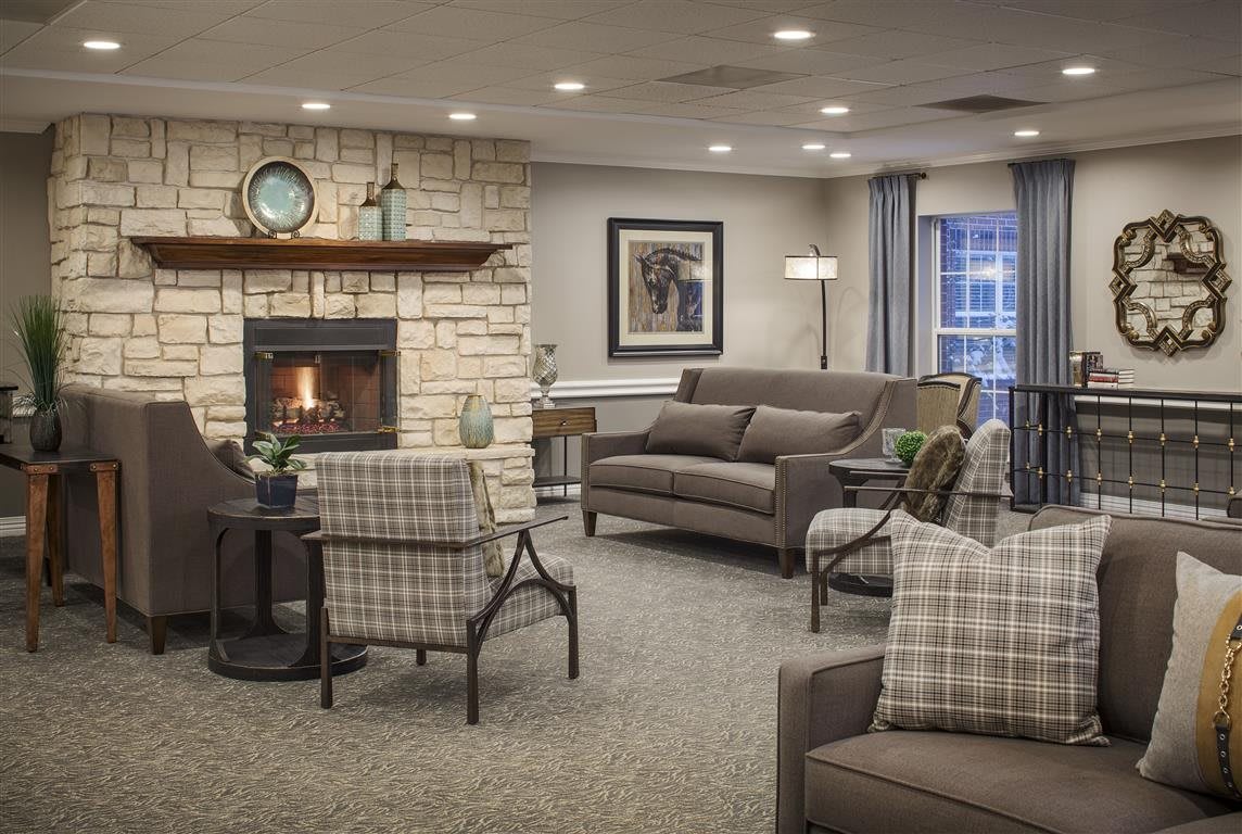 Cozy and elegantly designed living room with a fireplace and comfortable seating.