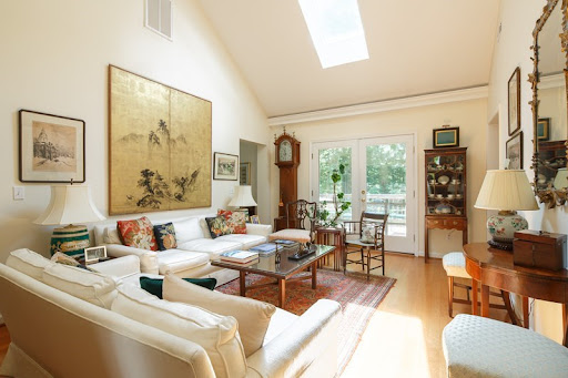 A bright and inviting living room featuring modern decor, ample natural light, and a cozy atmosphere.