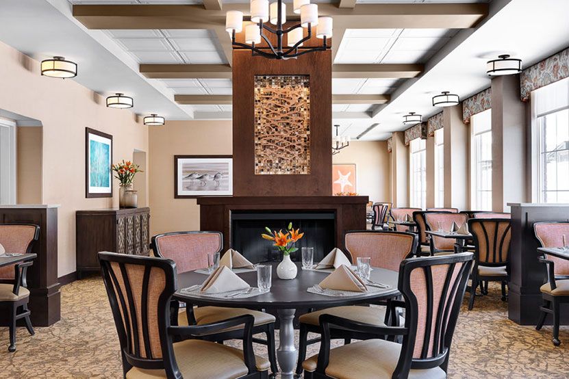 Elegant dining room interior with a neatly set table.