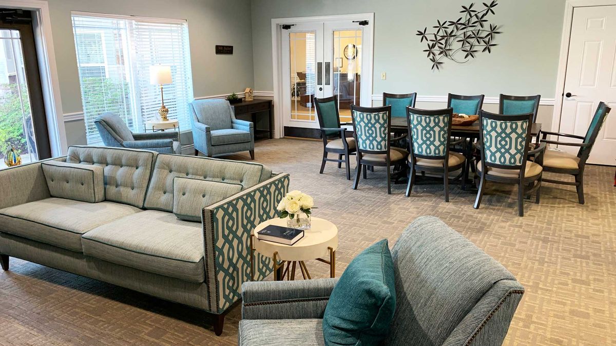 A modern living and dining area with elegant furniture and decor.