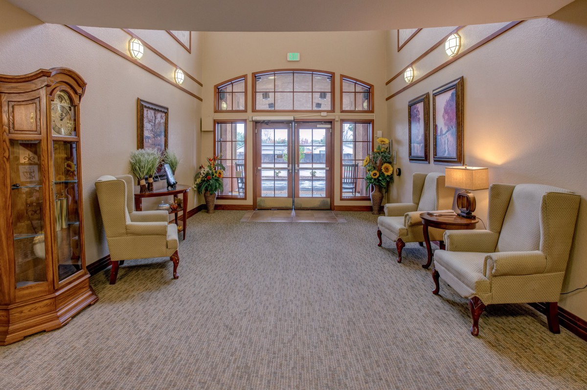 A well-decorated lobby with elegant seating and large windows.