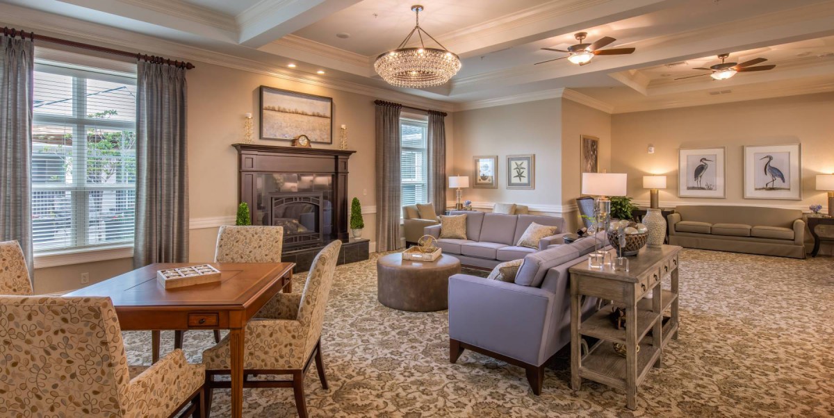 A cozy living room with comfortable seating and a fireplace.