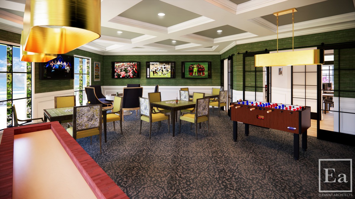 A modern game room featuring multiple seating areas, a foosball table, and large screen televisions on green-painted walls.