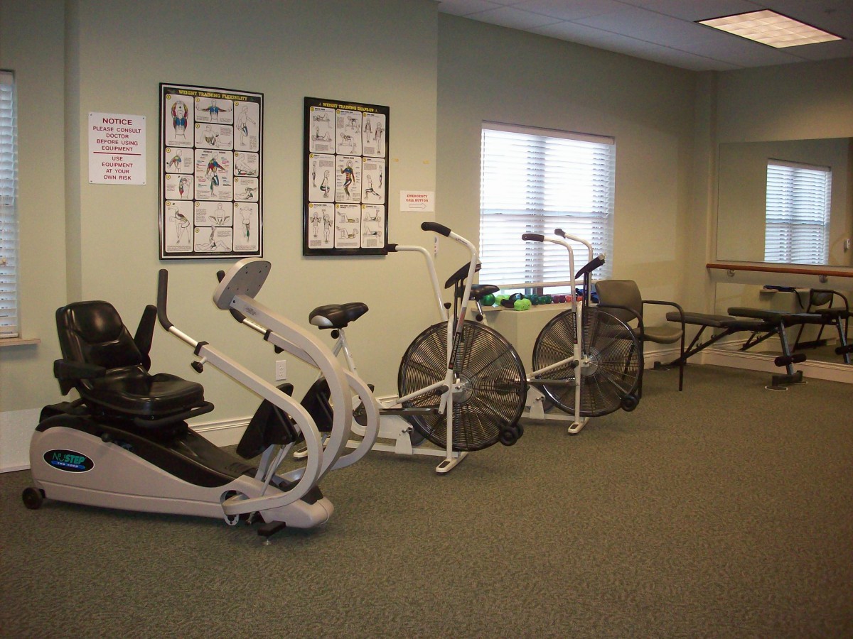A small gym with exercise bikes and fitness equipment.
