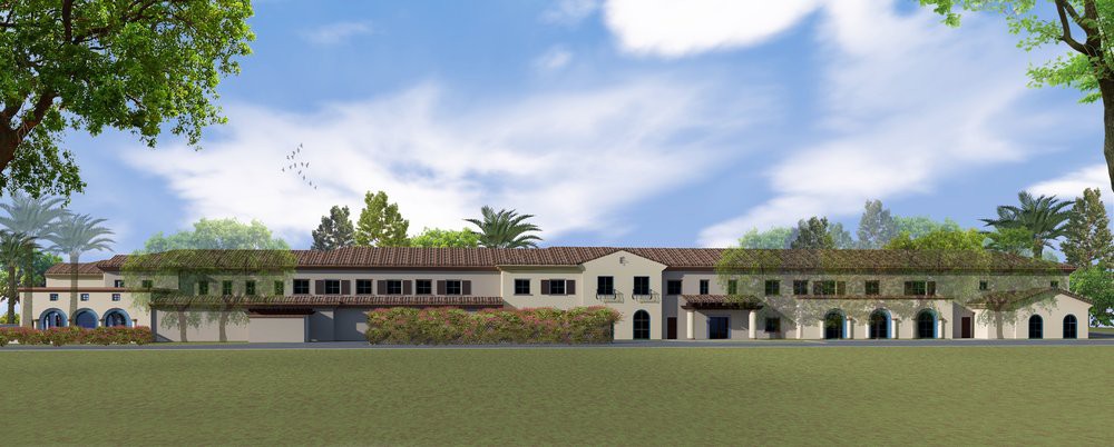 A scenic view of a large building with traditional architecture, set against a backdrop of trees and a cloudy sky.