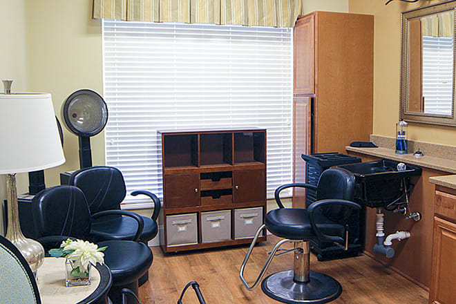 A cozy salon setup with stylish chairs and essential equipment.