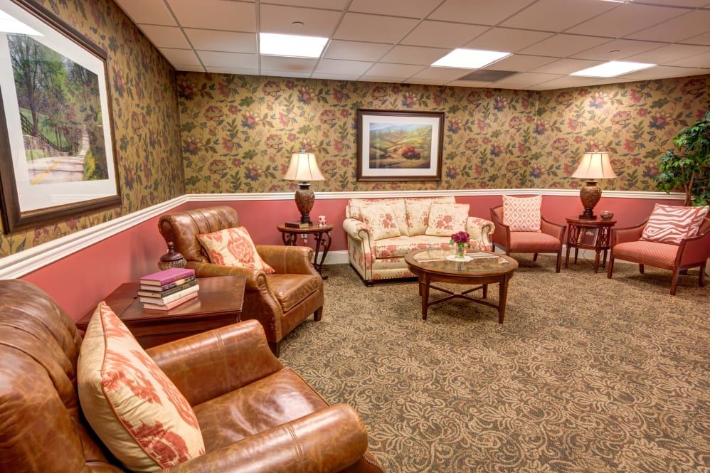 A cozy living room with comfortable seating and warm lighting.