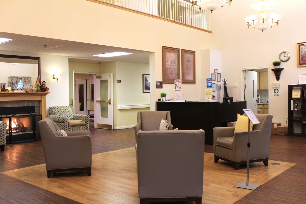 A comfortable and spacious lobby area with seating and a reception desk.