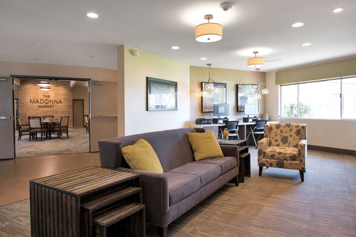 A modern living room with a cozy sofa and stylish lighting.