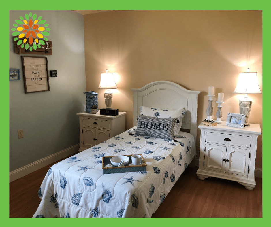 A cozy bedroom with a single bed, flanked by two nightstands and softly lit by lamps.