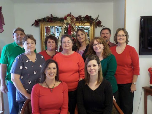 A cheerful group of friends celebrating the holiday season together.