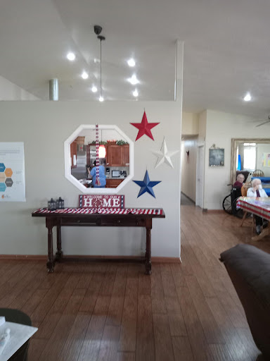 A cozy home interior featuring a decorated living space with stars and a welcoming table.