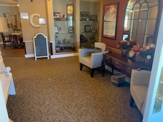 A cozy lobby area with seating and decorative elements.