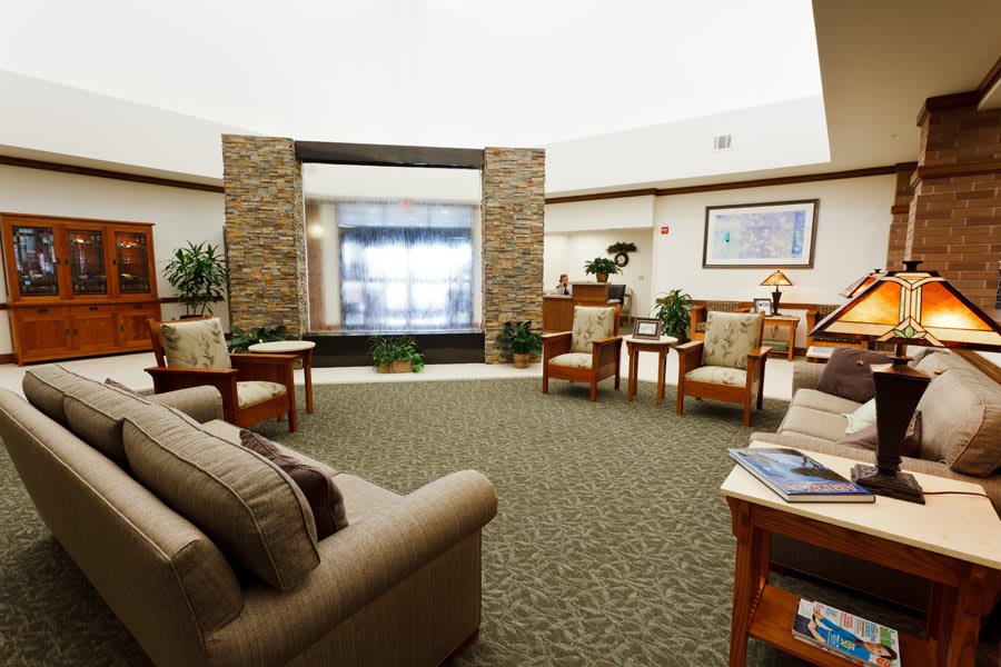 A cozy lobby with comfortable seating and natural decor.