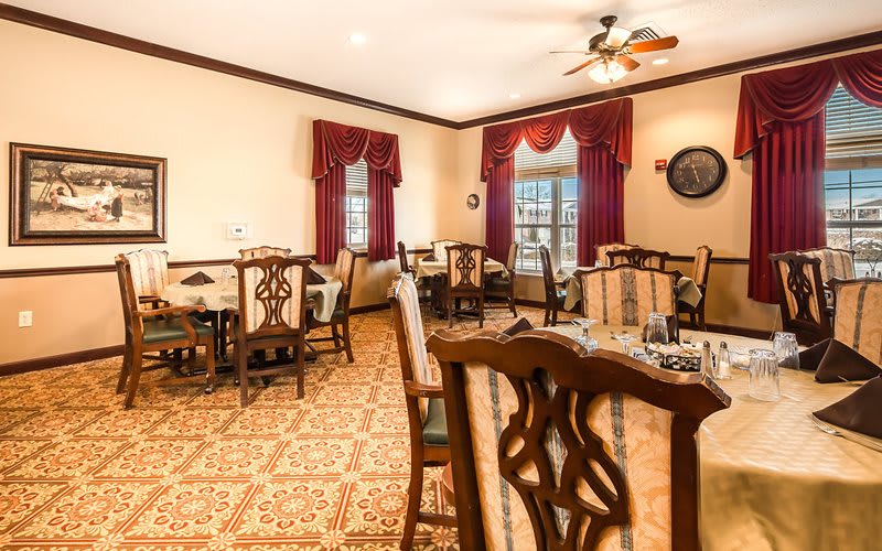 A traditional dining room with wooden furniture and elegant decor.