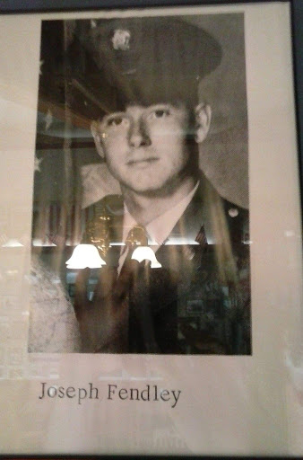 A vintage black and white portrait of a serviceman in military uniform.